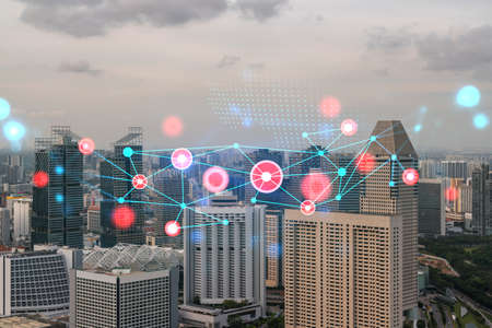 Hologram of abstract technology glowing icons, panoramic cityscape of Singapore at sunset, Asia. The...