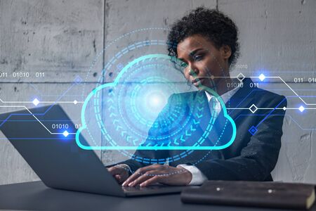 Businesswoman typing on laptop work in modern office on new project. Cloud tech drawing hologram....