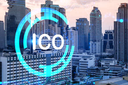 Hologram of glowing ICO icon, sunset panoramic city view of Bangkok, startup incubator of cryptocurrency projects in Asia. The concept of affordable opportunities in new era. Double exposure.の写真素材