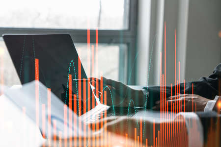 Two business people working together on stock market strategy. Try to analyze forex behavior....
