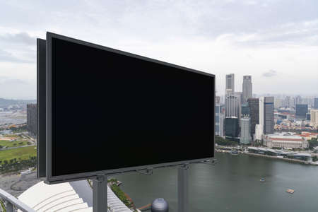 Blank black road billboard with Singapore cityscape background at day time. Street advertising...