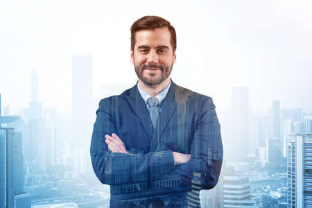 Prosperous European entrepreneur in suit in crossed arms pose. Kuala Lumpur cityscape. The concept of problem solving. KL skyscrapers. Double exposure.の写真素材
