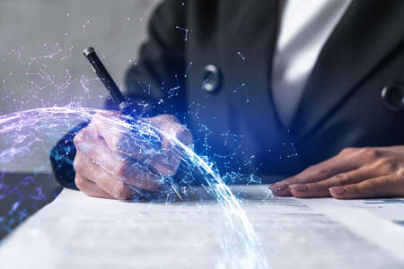 Woman signs contract with abstract network hologram. Double exposure.の写真素材