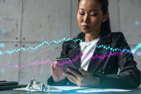 Businesswoman typing phone, work in modern office on new project. forex graph hologram. Double...