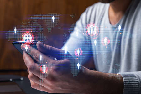 Man using phone. Hands typing smartphone. Double exposure with world map planet earth hologram....