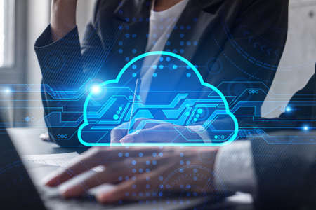 Two businesswomen working together in office. Cloud holographic illustration double exposure.