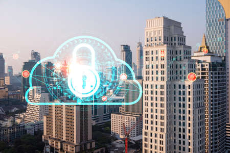 Hologram of Padlock on sunset panoramic cityscape of Bangkok, Asia. The concept of cyber security...