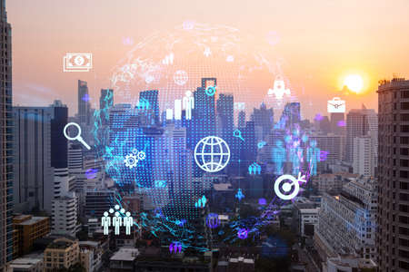 Hologram of social media icons over sunset panoramic cityscape of Bangkok, Asia. The concept of...