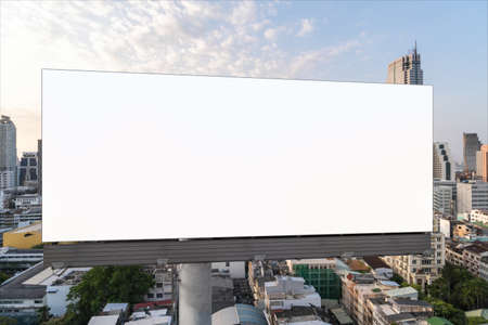 Blank white road billboard with Bangkok cityscape background at sunset. Street advertising poster,...