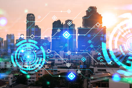 Glowing hologram of technological process, aerial panoramic cityscape of Bangkok at sunset. The...