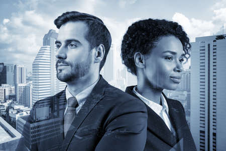 Portraits of two young business partners in suits dreaming about new career opportunities....