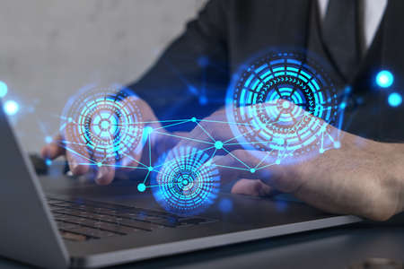 Double exposure of man typing computer on high tech project. Technology hologram. Concept of...