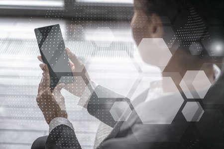 Businesswoman using phone, work in modern office on new project. Double exposure. Concept of...
