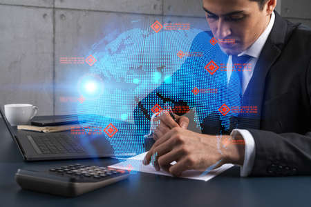 Man office takes notes use phone map world concept. Double exposure.の写真素材