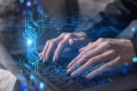 Businesswoman typing on laptop in office. Technology network illustration hologram.