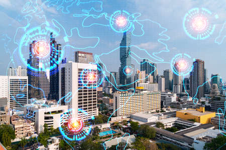 World planet Earth map hologram over panorama city view of Bangkok, Asia. The concept of...