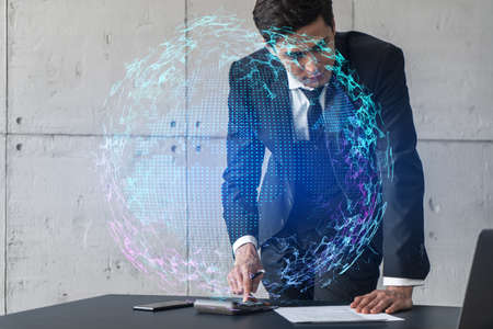 Businessman in office signs contract and world map hologram. Double exposure. Formal wear....