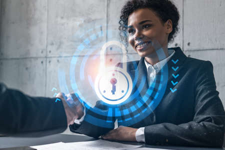 Two woman handshake. Education protection of data hologram. Multiexposure. International business.の写真素材