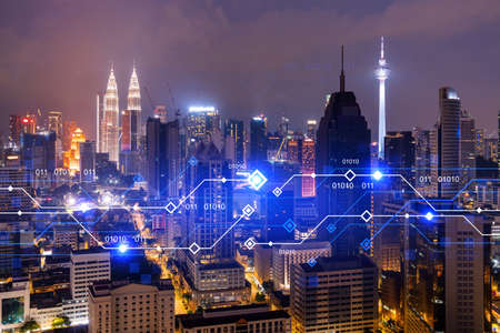 Information flow hologram, night panorama city view of Kuala Lumpur. KL is the largest technological center in Malaysia, Asia. The concept of programming science. Double exposure.の写真素材