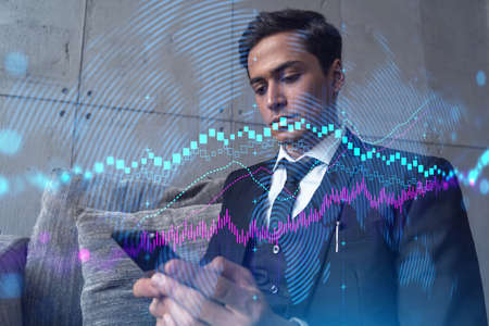 Trader in office working with Smartphone, FOREX graph hologram to analyze market behavior, typing...