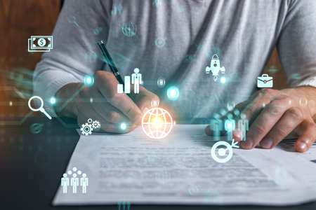 Double exposure of man signing contract and business hologram. Infographic of research and...