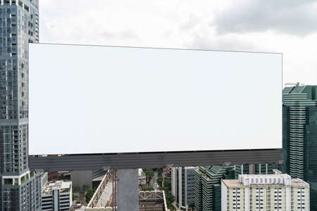 Blank white road billboard with Singapore cityscape background at day time. Street advertising poster, mock up, 3D rendering. Front view. The concept of marketing communication to promote.の写真素材