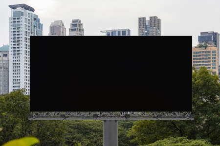Blank black road billboard with Bangkok cityscape background at day time. Street advertising poster, mock up, 3D rendering. Front view. The concept of marketing communication to promote or sell idea.の写真素材