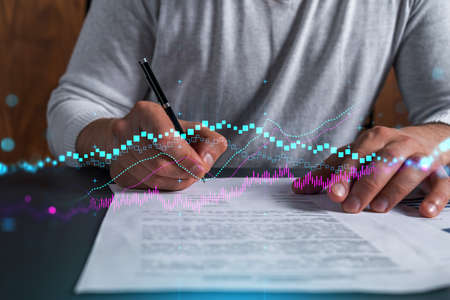 Double exposure of man signing contract and forex graph hologram. Blue infographic business chart....