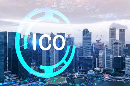 ICO icon hologram over panorama city view of Singapore, the hub of blockchain projects in Asia. The...