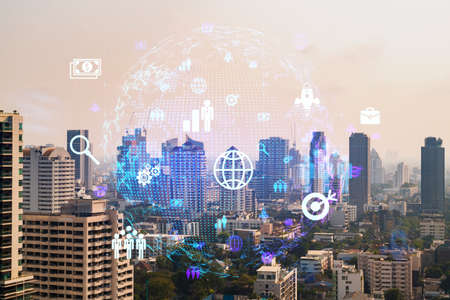 Social media icons hologram over panorama city view of Bangkok, Asia. The concept of people...