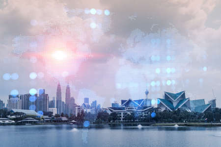 World planet Earth map hologram over panorama city view of Kuala Lumpur, Malaysia, Asia. The concept of international connections and business. Multi Exposure.の写真素材