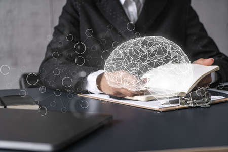 Technology brain hologram and a woman taking notes. Multiexposure.