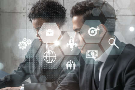 Two businesspeople working on project on capital market. Multiexposure.の写真素材