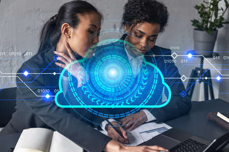 Two businesswomen work together in modern office on new project. Double exposure. Concept of...