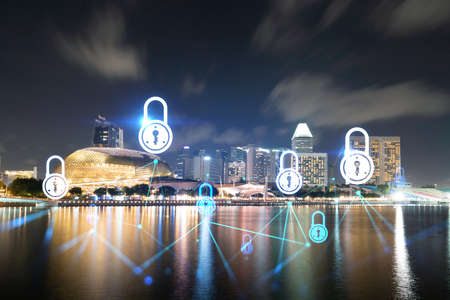 Glowing Padlock hologram, night panoramic city view of city, Asia. The concept of cyber security to...