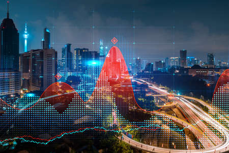 FOREX graph hologram, aerial night panoramic cityscape of Kuala Lumpur. KL is the developed location for stock market researchers in Malaysia, Asia. The concept of fundamental analysis.の写真素材