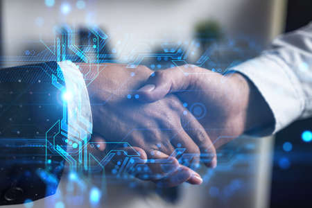 Double exposure of two businesspeople handshake and binary technology hologram drawing background. Concept of partnership and agreement. Formal wear.の写真素材