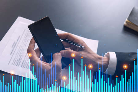 Businessman search and analyze using on-line app on phone. Financial graph hologram.