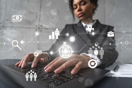 Businesswoman typing on laptop work in modern office on new project. Business icon drawing hologram....