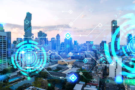 Glowing hologram of technological process, aerial panoramic cityscape of Bangkok at sunset. The largest innovative hub of tech services in Asia. Multi exposure.の写真素材