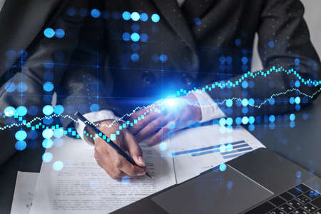 Multiexposure of woman taking notes and financial chart. Success concept. Formal wear.