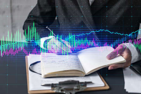 Multiexposure of woman taking notes and financial chart. Success concept. Formal wear.