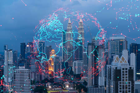 Hologram of Earth planet map on night panoramic cityscape of Kuala Lumpur, Malaysia, Asia. The concept of international companies in KL. Multi Exposure.の写真素材