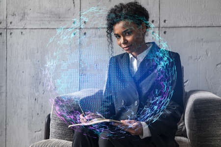Businesswoman typing on laptop work in modern office on new project. World map drawing hologram....