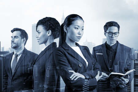 Group of four business colleagues in suits working and dreaming about new career opportunities after...