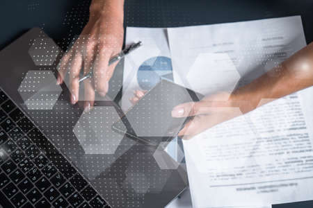 Abstract moder technology theme hologram and a woman signing contract use phone. Multiexposure.