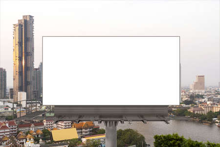Blank white road billboard with Bangkok cityscape background at day time. Street advertising poster,...