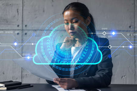 Asian businesswoman dream of success. Storage cloud drawing hologram. Double exposure.の写真素材