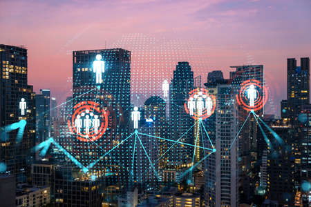 Hologram of social media icons over sunset panoramic cityscape of Bangkok, Asia. The concept of...