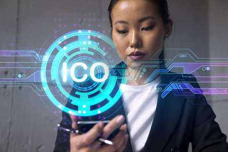 Businesswoman typing phone, work in modern office on new project. ICO blockchain hologram. Double...